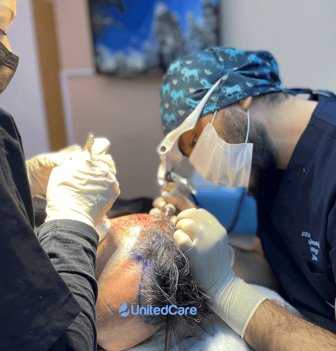 Dr. K extracting follicles from the donor site